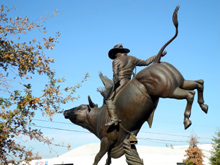 Bull rider guards the entrance to the Clovis Rodeo Grounds 