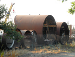 Rusted cylinders in scrap yard near downtown