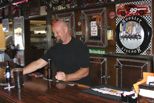 Stan serves 'em up behind the bar at the Pizza Pit