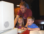 Brad Strait and his kids check out an Amiga game