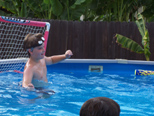Defending the net in a birthday water polo game