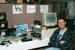 Cameron Kaiser next to his exhibit of micro-computers